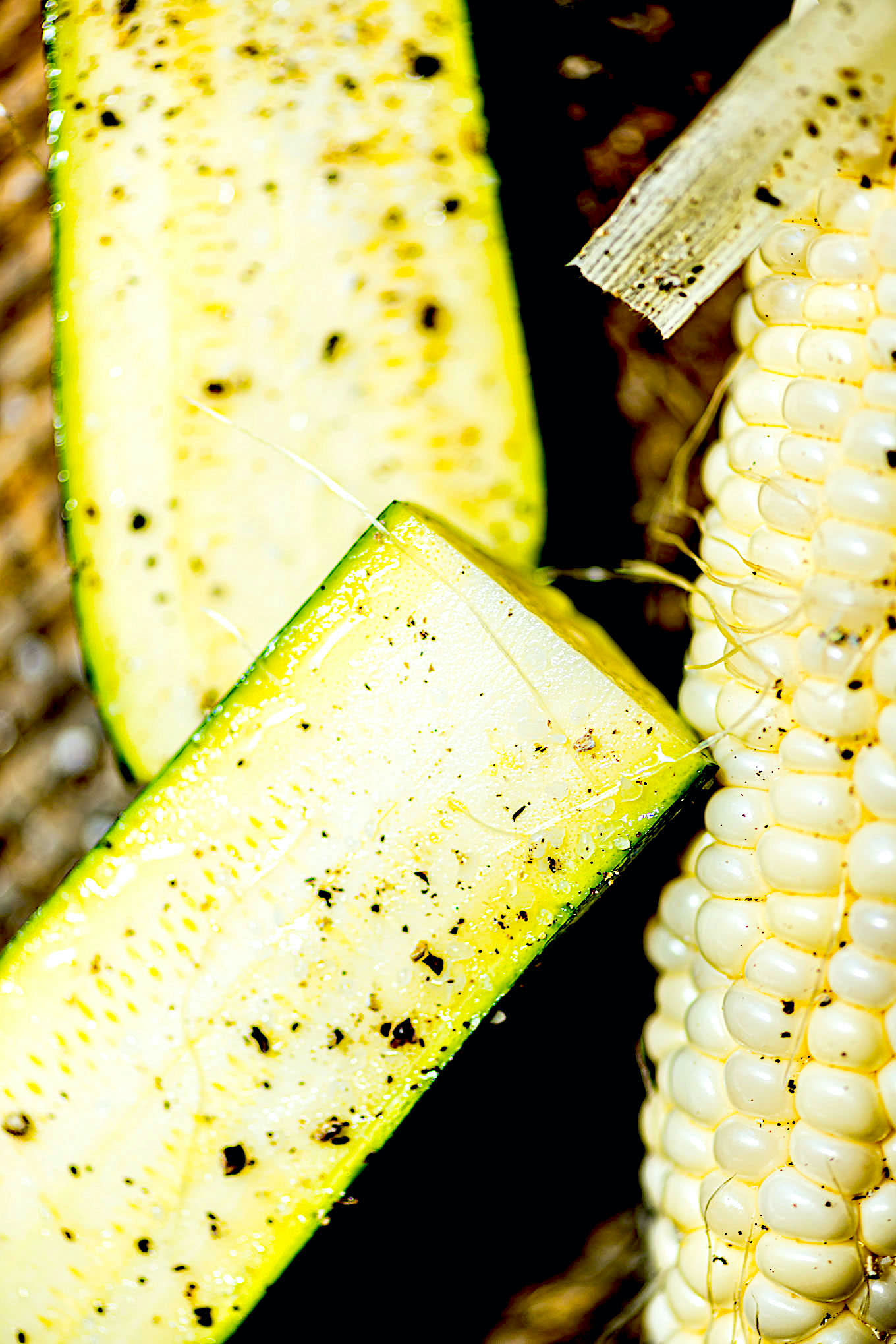 A closeup of some zucchini and corn before grilling.